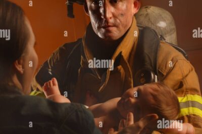 Out of the Flames: A Firefighter Carries Life in His Arms.1114
